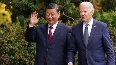 Chinese President Xi Jinping waves as he walks with US President Joe Biden at Filoli estate on the sidelines of the Asia-Pacific Economic Cooperation (APEC) summit, in Woodside, California. (Reuters)