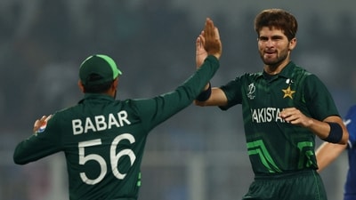 Pakistan's Shaheen Afridi celebrates with Babar Azam after taking the wicket of England's Joe Root (REUTERS)