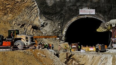 Heavy machinery moves outside a tunnel where 40 road workers are trapped after a portion of the tunnel collapsed in Uttarkashi in the northern state of Uttarakhand, (REUTERS)