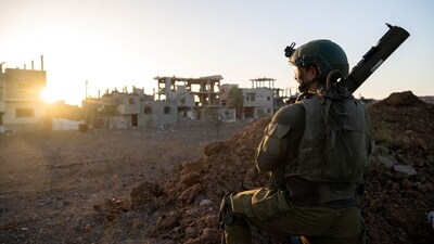 An Israeli soldier takes position during the ongoing ground operation of the Israeli army against Palestinian Islamist group Hamas, at a location given as Gaza, in this picture released on November 17, 2023. (Reuters)