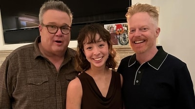 Eric Stonestreet and Jesse Tyler Ferguson pose with their onscreen daughter Aubrey Anderson-Emmons at the Modern Family reunion. She played Cameron and Mitchell's adopted daughte Lily from Vietnam in the show. Eric Stonestreet and Jesse Tyler Ferguson pose with their onscreen daughter Aubrey Anderson-Emmons at the Modern Family reunion. She played Cameron and Mitchell's adopted daughte Lily from Vietnam in the show. 