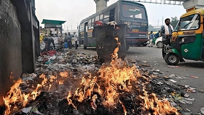 New Delhi, India - Nov. 15, 2023: Smoke rises from the smoldering fire of burning garbage near Anand Vihar Metro Station, in New Delhi, India, on Wednesday, November 15, 2023. (Photo by Sanjeev Verma/ Hindustan Times) (Hindustan Times) New Delhi, India - Nov. 15, 2023: Smoke rises from the smoldering fire of burning garbage near Anand Vihar Metro Station, in New Delhi, India, on Wednesday, November 15, 2023. (Photo by Sanjeev Verma/ Hindustan Times) (Hindustan Times)