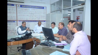 Principal chief commercial manager, NCR, Prabhat Ranjan monitoring functioning of Prayagraj divisional war room and checking the status of grievance on his mobile phone. (HT photo) Principal chief commercial manager, NCR, Prabhat Ranjan monitoring functioning of Prayagraj divisional war room and checking the status of grievance on his mobile phone. (HT photo)