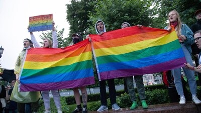 LGBT activists wave their flags during a rally to cancel the results of voting on amendments to the Constitution in Moscow (AP) LGBT activists wave their flags during a rally to cancel the results of voting on amendments to the Constitution in Moscow (AP)