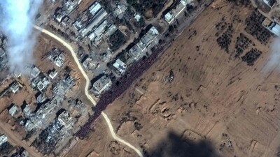 Crowd of people fleeing toward the southern part of the Gaza Strip, gathered along the Salah Al-Din road. (AFP) Crowd of people fleeing toward the southern part of the Gaza Strip, gathered along the Salah Al-Din road. (AFP)