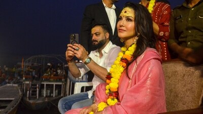 Sunny Leone watches Ganga Aarti in Varanasi on Thursday. (PTI) Sunny Leone watches Ganga Aarti in Varanasi on Thursday. (PTI)
