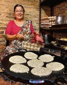 Alka Rani, who sells malpuas at a stall near Naraina Vihar Metro Station, shares that she doesn't charge for this sweet treat during the three days of Chhath. Alka Rani, who sells malpuas at a stall near Naraina Vihar Metro Station, shares that she doesn't charge for this sweet treat during the three days of Chhath.