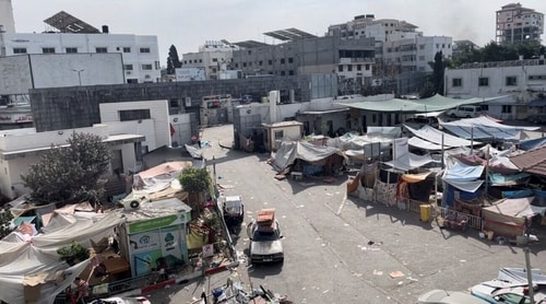 Tents and shelters used by displaced Palestinians stand at the yard of Al Shifa hospital during the Israeli ground operation around the hospital, in Gaza City November 12, 2023. (Reuters)