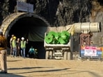 A supply truck loaded with augers prepares to enter a tunnel where 40 road workers are trapped after a portion of the tunnel collapsed in Uttarkashi in the northern state of Uttarakhand