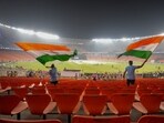 Fans wave the Indian flags during a practice session ahead of the ICC Men's Cricket World Cup 2023's final match between India and Australia, at the Narendra Modi Stadium, in Ahmedabad, Saturday Fans wave the Indian flags during a practice session ahead of the ICC Men's Cricket World Cup 2023's final match between India and Australia, at the Narendra Modi Stadium, in Ahmedabad, Saturday