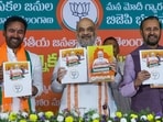 Union Home Minister Amit Shah with Union Minister and Telangana BJP President G. Kishan Reddy and party leader Prakash Javadekar releases the party's manifesto for the Telangana Assembly elections.