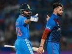 Virat Kohli and Naveen ul Haq during India and Afghanistan encounter in ICC World Cup. Virat Kohli and Naveen ul Haq during India and Afghanistan encounter in ICC World Cup.