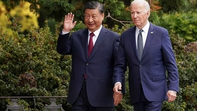 Chinese President Xi Jinping waves as he walks with US President Joe Biden at Filoli estate on the sidelines of the Asia-Pacific Economic Cooperation (APEC) summit, in Woodside, California. (Reuters)