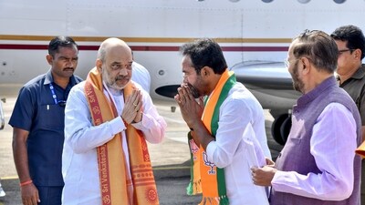 Union Home Minister Amit Shah being received by Union Minister and Telangana BJP President G. Kishan Reddy upon his arrival at Shamshabad airport, near Hyderabad on November 18. (PTI) Union Home Minister Amit Shah being received by Union Minister and Telangana BJP President G. Kishan Reddy upon his arrival at Shamshabad airport, near Hyderabad on November 18. (PTI)