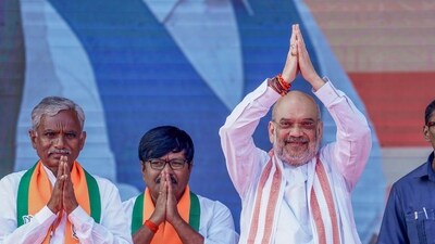 Union Home Minister Amit Shah with BJP leaders waves to the crowd during a public meeting in Jogulamba Gadwal district on November 18. (PTI) Union Home Minister Amit Shah with BJP leaders waves to the crowd during a public meeting in Jogulamba Gadwal district on November 18. (PTI)