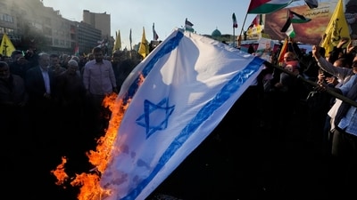 Israel-Hamas War: Iranian demonstrators burn a representation of the Israeli flag and wave the Palestinian flags in a pro-Palestinian rally in Tehran, Iran. (AP) Israel-Hamas War: Iranian demonstrators burn a representation of the Israeli flag and wave the Palestinian flags in a pro-Palestinian rally in Tehran, Iran. (AP)