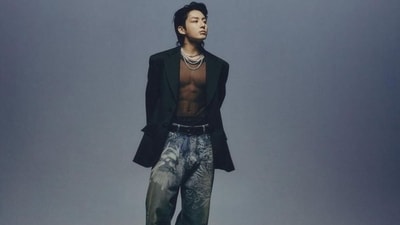Here, Jungkook wears a see-through black net top to show off his killer abs. He styled it with a notch lapel oversized blazer and printed baggy-fit denim jeans. Chelsea boots, layered chains, a black leather belt, back-swept hairdo, and a lip ring gave the finishing touch. (Instagram) Here, Jungkook wears a see-through black net top to show off his killer abs. He styled it with a notch lapel oversized blazer and printed baggy-fit denim jeans. Chelsea boots, layered chains, a black leather belt, back-swept hairdo, and a lip ring gave the finishing touch. (Instagram)