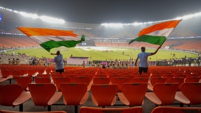 Fans wave the Indian flags during a practice session ahead of the ICC Men's Cricket World Cup 2023's final match between India and Australia, at the Narendra Modi Stadium, in Ahmedabad, Saturday (PTI) Fans wave the Indian flags during a practice session ahead of the ICC Men's Cricket World Cup 2023's final match between India and Australia, at the Narendra Modi Stadium, in Ahmedabad, Saturday (PTI)