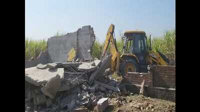 The district administration in coordination with Ambala Police on Friday razed the illegal factory in Mullana town that manufactured fake spurious liquor that killed 20. (HT Photo)