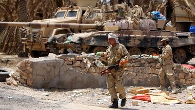 Iraqi Army soldiers with new US-made weapons take combat positions at the front line in an eastern suburb of Ramadi, backed by Shiite and Sunni pro-government fighters (AP Photo) Iraqi Army soldiers with new US-made weapons take combat positions at the front line in an eastern suburb of Ramadi, backed by Shiite and Sunni pro-government fighters (AP Photo)