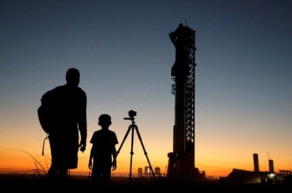 Spectators look on as SpaceX's next-generation Starship spacecraft, atop its powerful Super Heavy rocket, is prepared for launch from the company's Boca Chica launchpad on an uncrewed test flight, near Brownsville, Texas, US on November 17. (Reuters)
