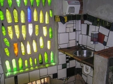 In 1999, the pretty public restrooms with multi-coloured tile collages and undulating lines, and recycled bottles that create a psychedelic design were opened and since then are the town’s biggest tourist attraction (Wikimedia Commons) In 1999, the pretty public restrooms with multi-coloured tile collages and undulating lines, and recycled bottles that create a psychedelic design were opened and since then are the town’s biggest tourist attraction (Wikimedia Commons)