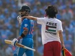 A Free Palestine protestor invades the pitch and puts his arm on the shoulder of India's Virat Kohli during the ICC Men's Cricket World Cup final A Free Palestine protestor invades the pitch and puts his arm on the shoulder of India's Virat Kohli during the ICC Men's Cricket World Cup final