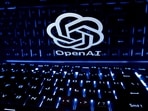 FILE PHOTO: A keyboard is placed in front of a displayed OpenAI logo in this illustration taken February 21, 2023.