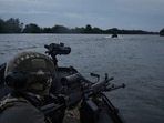 Russia-Ukraine War: Ukrainian soldiers navigate on the Dnipro river by boat at the frontline near Kherson, Ukraine. Russia-Ukraine War: Ukrainian soldiers navigate on the Dnipro river by boat at the frontline near Kherson, Ukraine.