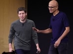 Microsoft CEO Satya Nadella (R) greets then OpenAI CEO Sam Altman during the OpenAI DevDay event on November 6 in San Francisco, California. 