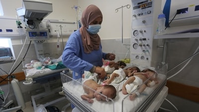 A nurse cares for prematurely born Palestinian babies that were brought from Shifa Hospital in Gaza City (AP) A nurse cares for prematurely born Palestinian babies that were brought from Shifa Hospital in Gaza City (AP)