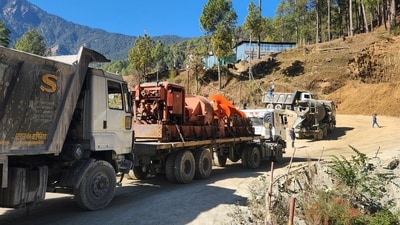 A new auger machine arrived at the site on Saturday where road workers are trapped in a tunnel after a portion of it collapsed, in Uttarkashi in the northern state of Uttarakhand. (REUTERS)