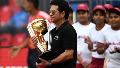 Sachin Tendulkar carried the World Cup trophy before the start of the first semi-final match between India and New Zealand at the Wankhede Stadium in Mumbai. (AFP) Sachin Tendulkar carried the World Cup trophy before the start of the first semi-final match between India and New Zealand at the Wankhede Stadium in Mumbai. (AFP)