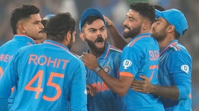 Virat Kohli celebrates the wicket of David Warner with teammates during the ICC Men's Cricket World Cup final match between India and Australia in Ahmedabad (AP) Virat Kohli celebrates the wicket of David Warner with teammates during the ICC Men's Cricket World Cup final match between India and Australia in Ahmedabad (AP)