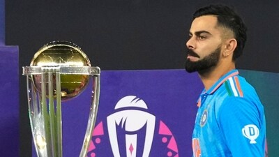 India's Virat Kohli walks past ICC Men's Cricket World Cup trophy to receive player of the tournament award (AP) India's Virat Kohli walks past ICC Men's Cricket World Cup trophy to receive player of the tournament award (AP)