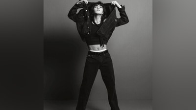 One of the pictures shows Jungkook in a cropped tank top showing off killer abs, layered with a denim jacket and matching denim jeans. He styled the ensemble with Chelsea boots, a scarf wrapped around his neck, hoop earrings, and rings. His retro-inspired curly locks stole the show. (Instagram/@calvinklein) One of the pictures shows Jungkook in a cropped tank top showing off killer abs, layered with a denim jacket and matching denim jeans. He styled the ensemble with Chelsea boots, a scarf wrapped around his neck, hoop earrings, and rings. His retro-inspired curly locks stole the show. (Instagram/@calvinklein)