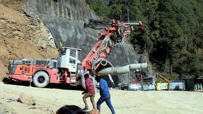 Uttarkashi: The under-construction tunnel between Silkyara and Dandalgaon on the Brahmakhal-Yamunotri national highway, days after a portion of the tunnel collapsed trapping several workers inside, in Uttarkashi district, Sunday, Nov. 19, 2023. (PTI Photo) (PTI11_19_2023_000309A) (PTI) Uttarkashi: The under-construction tunnel between Silkyara and Dandalgaon on the Brahmakhal-Yamunotri national highway, days after a portion of the tunnel collapsed trapping several workers inside, in Uttarkashi district, Sunday, Nov. 19, 2023. (PTI Photo) (PTI11_19_2023_000309A) (PTI)