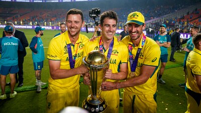 Australian captain Pat Cummins, Josh Hazlewood and M Starc pose for photographs with the trophy (PTI) Australian captain Pat Cummins, Josh Hazlewood and M Starc pose for photographs with the trophy (PTI)