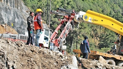 The under-construction tunnel between Silkyara and Dandalgaon on the Brahmakhal-Yamunotri national highway, days after a portion of the tunnel collapsed trapping several workers inside, in Uttarkashi district, on Sunday. (PTI) The under-construction tunnel between Silkyara and Dandalgaon on the Brahmakhal-Yamunotri national highway, days after a portion of the tunnel collapsed trapping several workers inside, in Uttarkashi district, on Sunday. (PTI)