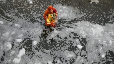 Yamuna River shows shadow pollution post-fireworks during Chhath Puja rituals at Delhi's Kalindi Kunj on Sunday. (Sunil Ghosh/HT Photo)