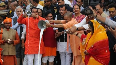 Uttar Pradesh Chief Minister Yogi Adityanath performs 'argh' during the Chhat Puja festival at Laxman Mela Ghat in Lucknow on Sunday. (Deepak Gupta/HT Photo)