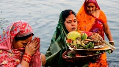 Usha Arghya marks the end of the festival with an offering to the rising sun. (AP Photo/Bikas Das) Usha Arghya marks the end of the festival with an offering to the rising sun. (AP Photo/Bikas Das)
