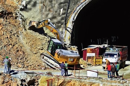 A heavy machinery works at the entrance to the site of an under-construction road tunnel that collapsed in Uttarakhand. (PTI) A heavy machinery works at the entrance to the site of an under-construction road tunnel that collapsed in Uttarakhand. (PTI)