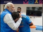 PM Modi and Mohammed Shami inside the dressing room. 