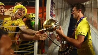 Australia's Pat Cummins celebrates with fans and the trophy after winning the ICC Cricket World Cup (REUTERS)