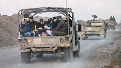 Israel's military transports Palestinian detainees from the Gaza Strip (REUTERS)