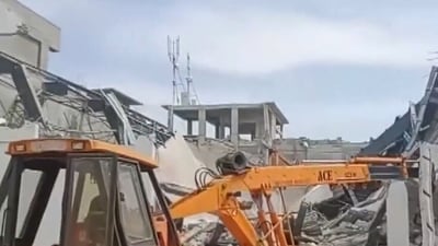 Wall of an under-construction private indoor stadium collapsed in Telangana's Moinabad on Tuesday. (ANI)