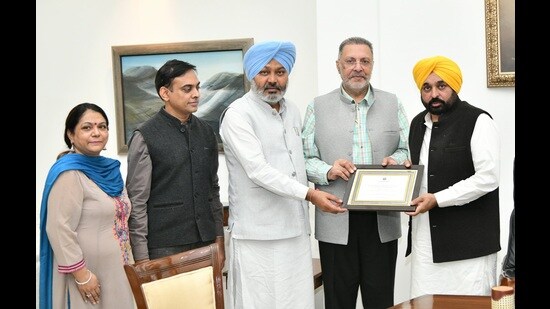 Punjab CM Bhagwant Mann, ministers Harpal Cheema and Dr Balbir Singh with the award on Monday. (Sourced)