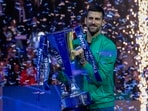 Serbia's Novak Djokovic celebrates with the trophy after winning the singles final of the ATP World Tour Finals. Serbia's Novak Djokovic celebrates with the trophy after winning the singles final of the ATP World Tour Finals.
