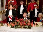 King Charles III listens as President of South Korea Yoon Suk Yeol speaks at the state banquet at Buckingham Palace.